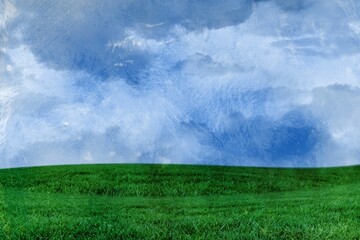 Green landscape against cloudy sky