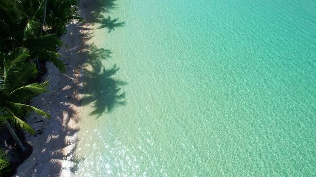 Nature of the beach and sea Summer with sunshine, sandy beaches, clear blue waters sparkling against the blue sky. On an island with good ecology and environment Background for summer vacation