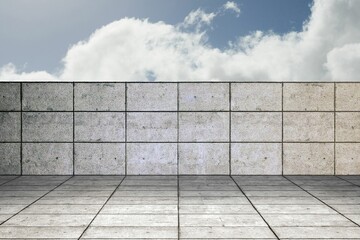 Low concrete tiled wall and matching floor are showing flat design plaza, with fluffy clouds