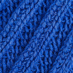 Close-up of textured blue knitted fabric.  Possible use textile design inspiration