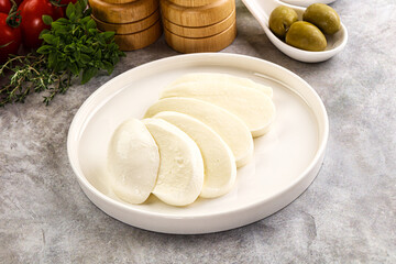 Organic mozzarella cheese slices in the plate