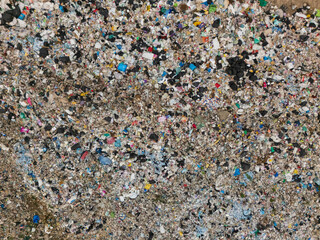 An aerial shot of a massive waste heap in an open field, symbolizing critical issues in waste management, pollution, and environmental sustainability.