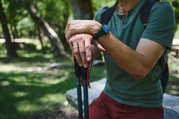 Close-Up of Traveler's Hands Holding Hiking Poles During Outdoor Adventure