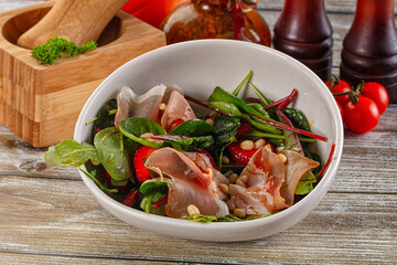 Salad with jamon, strawberry and arugula