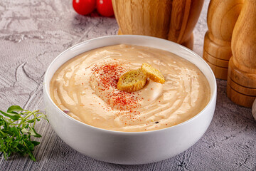 Tasty cheese cream soup with crouton