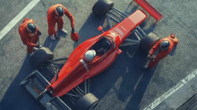 An exciting Formula 1 pit stop sees skilled mechanics rapidly changing tires with highspeed precision and expertise