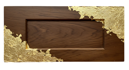 Opulent golden leaf accents adorn a rustic wooden panel with rich brown tones, creating a stylish and textural backdrop.