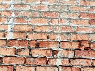 Obraz premium Red brick wall. Texture of old dark brown and red brick wall panoramic backgorund.Old red brick wall background, wide panorama of masonry.red brick wall texture grunge background.