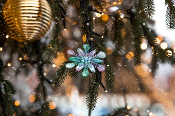 Snowflakes on the Christmas tree. Fairy-tale Christmas background. Concept of preparation and...