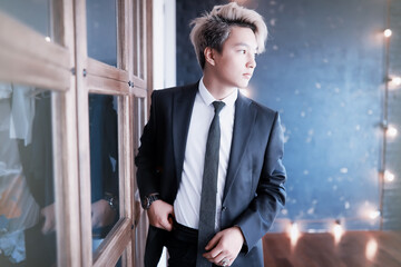 Young Asian businessman in white shirt and tie