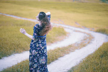 Pregnant girl in a dress in nature