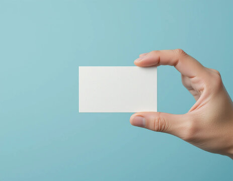 hand holding a blank business card
