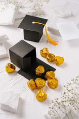 Graduation celebration with chocolate treats and graduation cap decorations