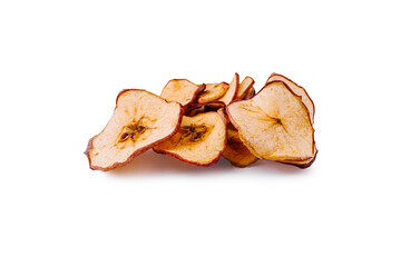 Dried apple slices piled on a white surface highlighting their texture and color