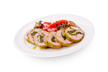 Succulent stuffed meat dish served with roasted vegetables and herbs