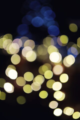 Abstract bokeh background. Golden bokeh circles on dark blue background. Layer overlay.