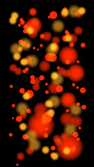 Glowing Red and Yellow Bokeh Light Background on Black.
