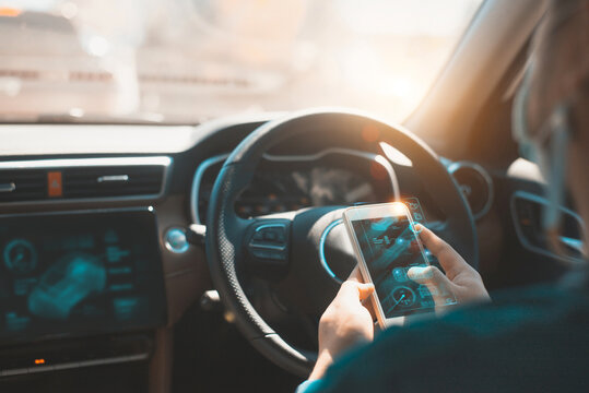 Person using augmented reality smartphone interface inside modern smart car. Concept of futuristic automotive technology, navigation, and connectivity in electric or autonomous vehicles. - Powered by Adobe