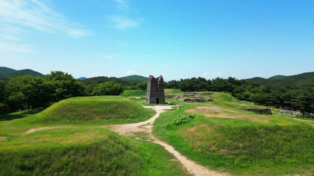 Ancient tombs stand on green hills, representing the rich history and cultural heritage of the goryeo dynasty in korea