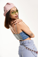 Stylish woman showcases vibrant fashion in a chic urban setting while striking a playful pose
