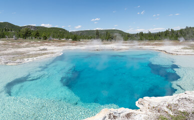 Obraz premium Steaming Geothermal Abyss pool in Yellowstone Park. Wyoming, USA