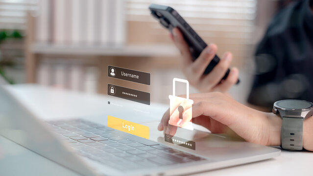 User logging in with digital username and password interface while holding smartphone. Concept of cybersecurity, data protection, two-factor authentication, and secure access system.