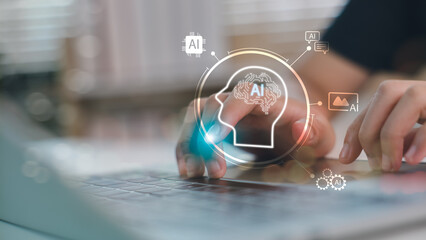 Hands typing on laptop with AI brain interface and smart icons. Concept of artificial intelligence,...