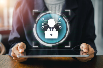IT expert using a digital tablet with a futuristic interface, symbolizing technology, innovation,...