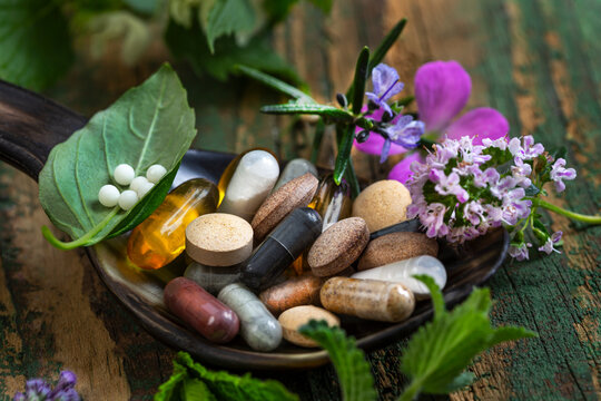 Herbal supplements on wooden background