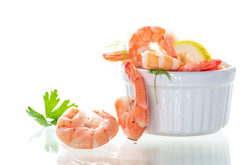 Boiled red shrimps with lemon on white background