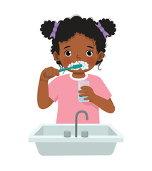 Little African girl brushing teeth with tooth brush for dental care 