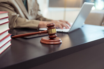 Judge, male lawyer discuss legal services for businessmen, give advice on contracts, plan court cases. © Worapon