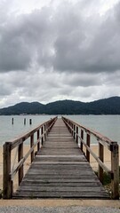 Obraz premium wooden bridge over the sea