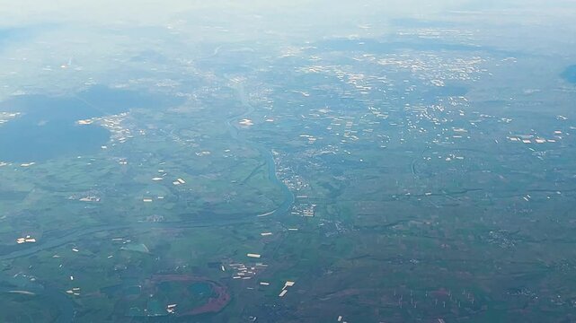 Picturesque view on landscape from the airplane porthole during the flight from Warsaw, Poland to Paris, France.
