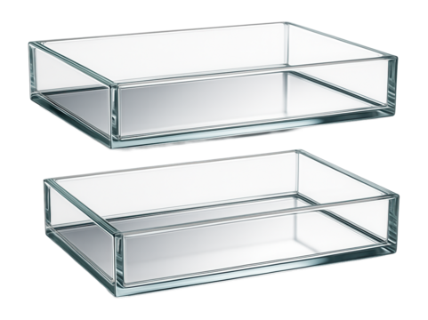 Glass open trays with a mirrored base, used for displaying perfumes on a bedroom dresser.