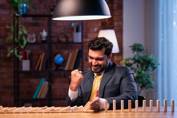 Indian executive halts domino fall, representing leadership, planning and risk mitigation