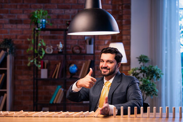 Indian executive halts domino fall, representing leadership, planning and risk mitigation