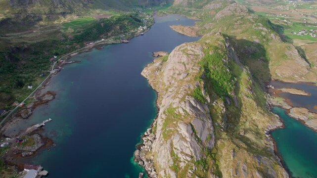 Majestic aerial panorama revealing Lofoten archipelago's dramatic landscape. Showcasing pristine Norwegian fjords. Rocky coastline. Vibrant turquoise waters from Sortland Steinsfjorden Viewpoint