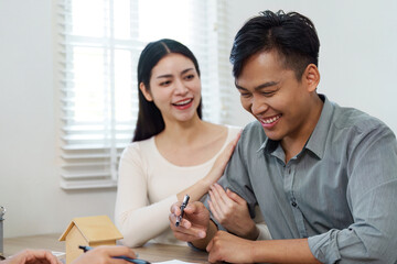 Real Estate Agent Assisting Happy Clients with Home Purchase