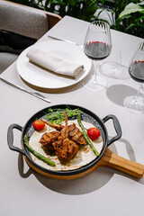 Delicious grilled lamb chops served with vegetables at a restaurant