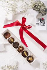 Graduation gift box featuring chocolates, flowers, and a cap symbolizing success