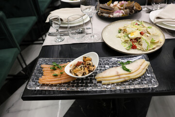 Festive table setting. Dishes and various dishes.