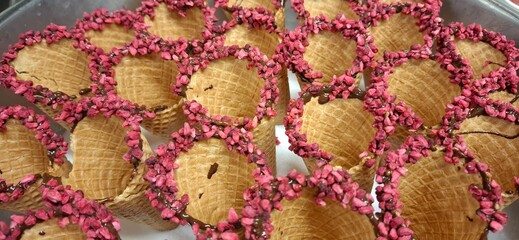 Assortment of Waffle Cones Decorated with Pink Candy Toppings
