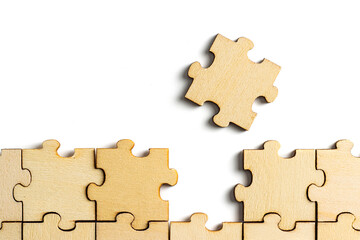 Obraz premium incomplete puzzle pieces, with seperated final pieces. Work and business concept with white background.