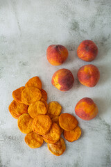 Peach and dried peach on a white background