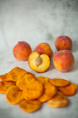 Peach and dried peach on a white background