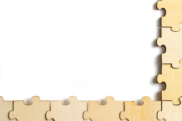 blank empty white space with wooden jigsaw puzzle frame. empty space for copy spaces.