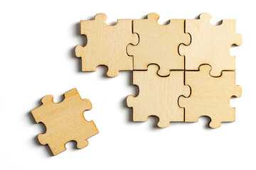 Fototapeta premium incomplete puzzle pieces, with seperated final pieces. Work and business concept with white background.