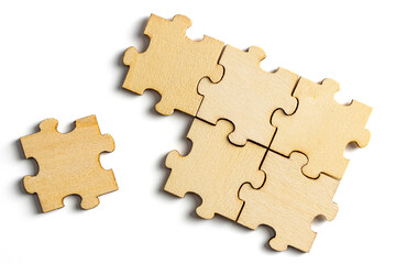 incomplete puzzle pieces, with seperated final pieces. Work and business concept with white...