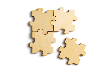 incomplete puzzle pieces, with seperated final pieces. Work and business concept with white...